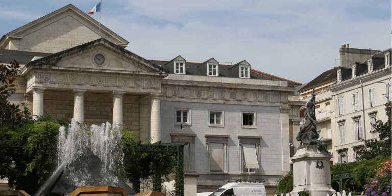 Photo of a shampoo bottle in a woman's hands