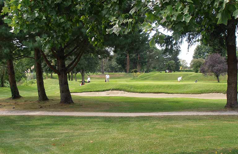 Photo of a shampoo bottle in a woman's hands